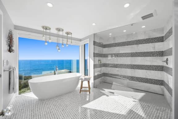 Distinguished Oceanfront Point Estate with Iconic Beach + Mountain Vistas